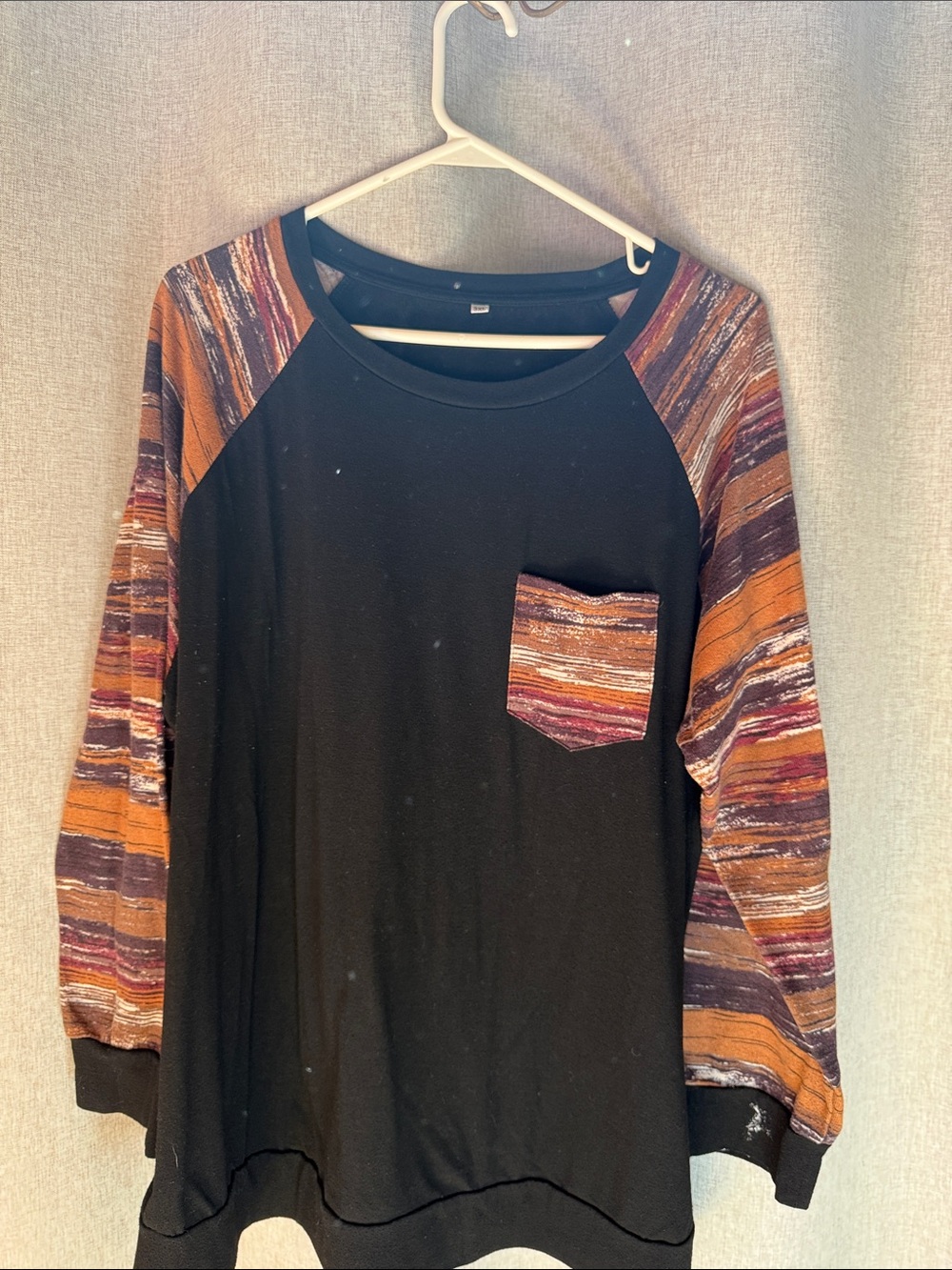 Black Top with Rust & Plum Striped Sleeves